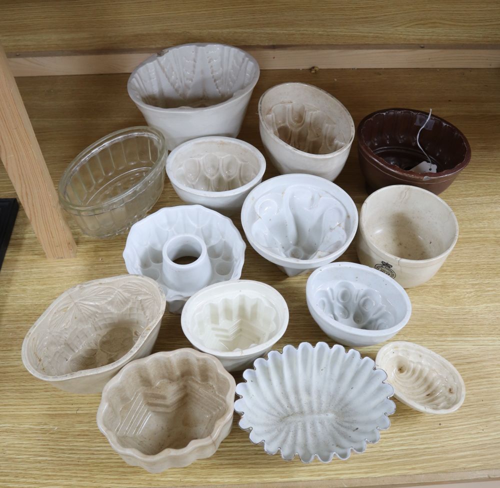 A collection of ceramic and toleware jelly moulds